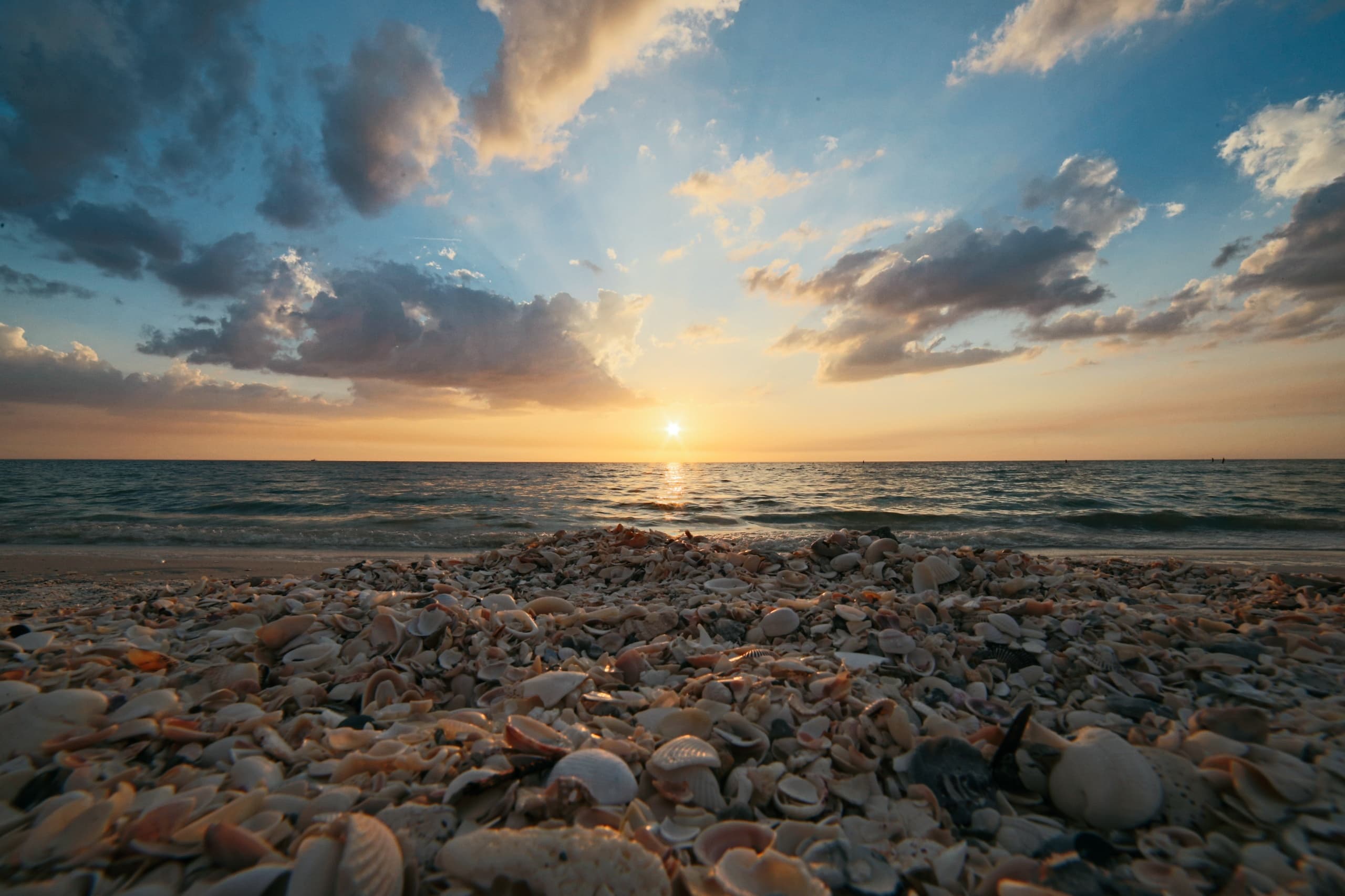 Rocky shoreline sunset with colorful sky at Hilton Head coast