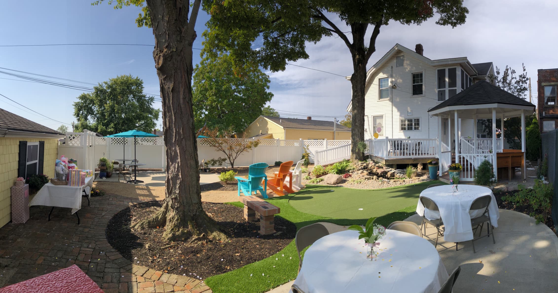 Backyard garden with trees, seating and backyard picnic setup