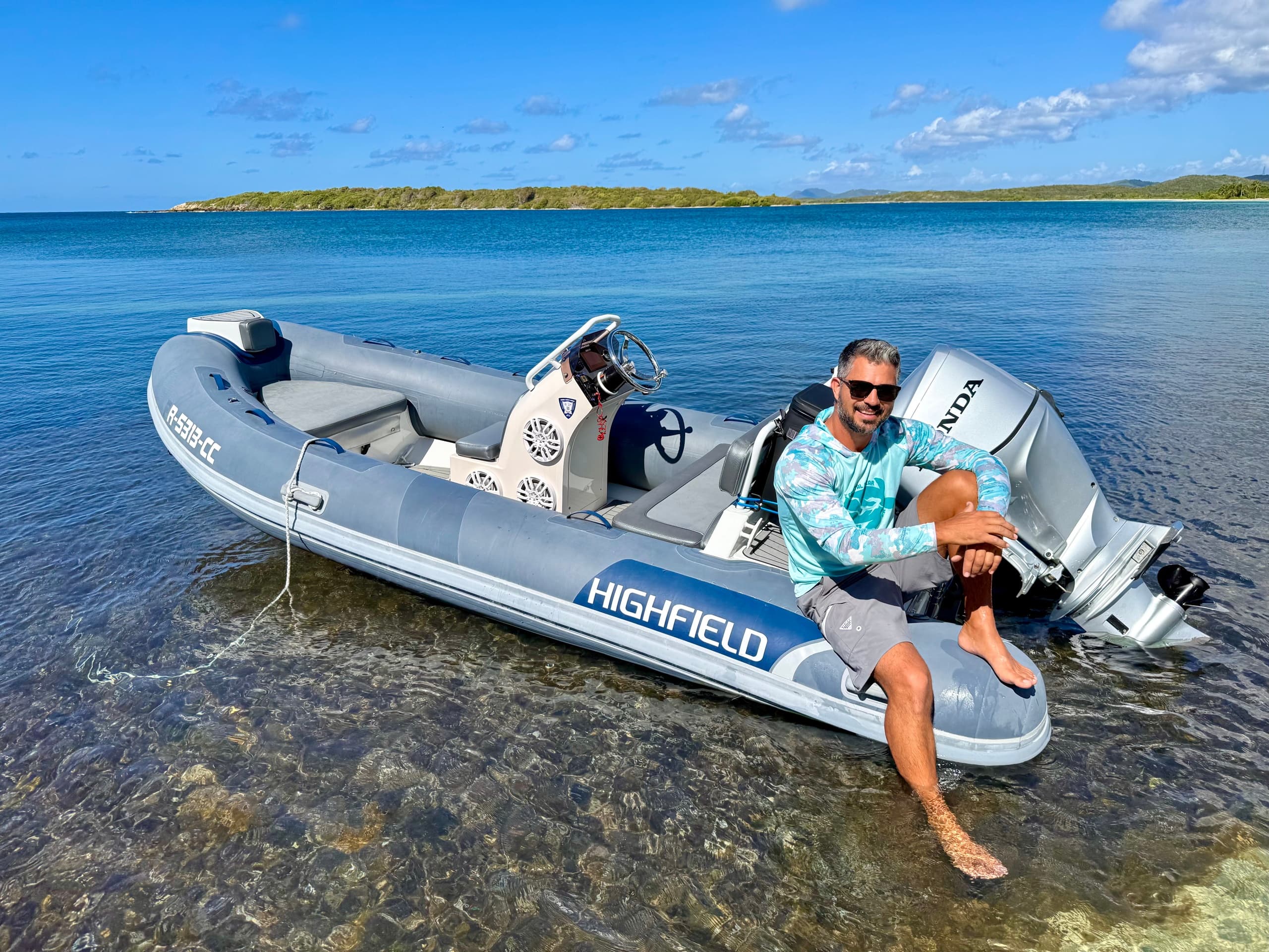 Guide on inflatable RIB near Vieques shoreline, clear waters