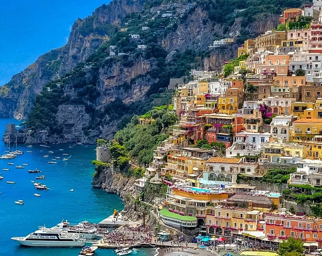 Colorful Positano cliffside village viewed from a boat tour