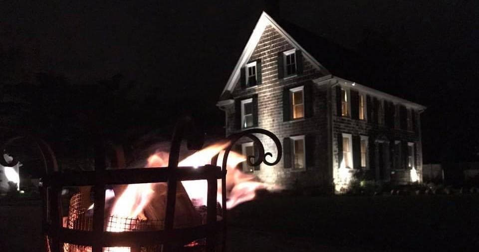 Nighttime historic Lewes house with outdoor firepit scene