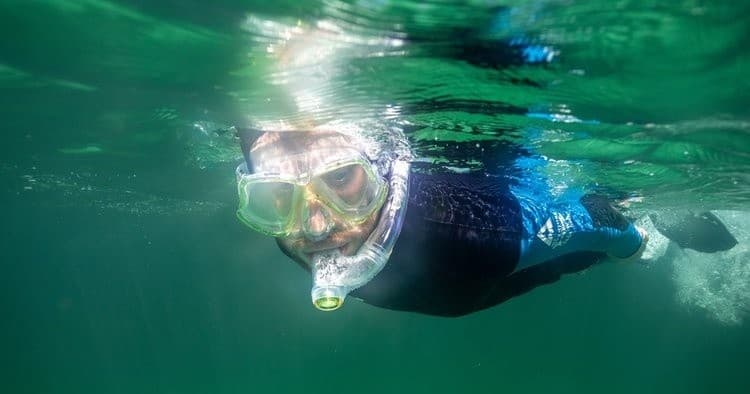 Close-up snorkeler face underwater in clear Scottish coastal sea