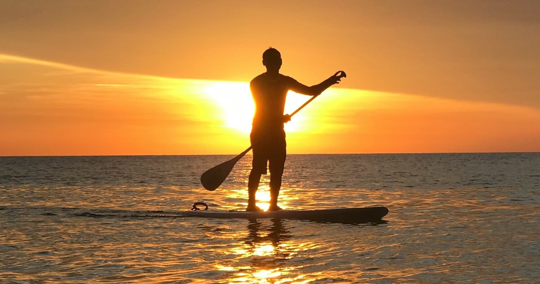 Water Activities & Tom's Surf Hire: Paddleboarding Fun