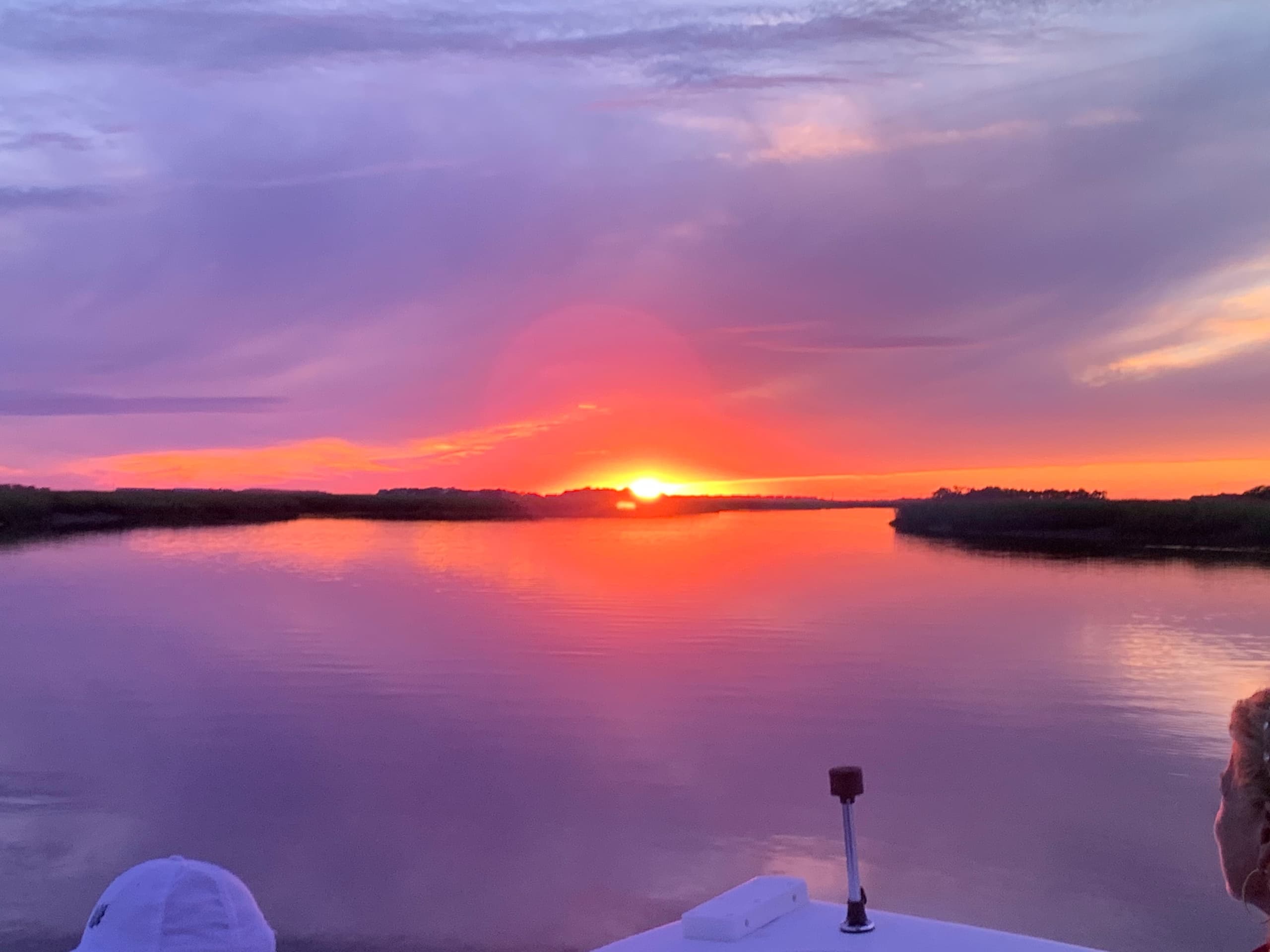 Experience the Magic of a Folly Beach Sunset Cruise with Dolphin Sightings and Morris Island Lighthouse