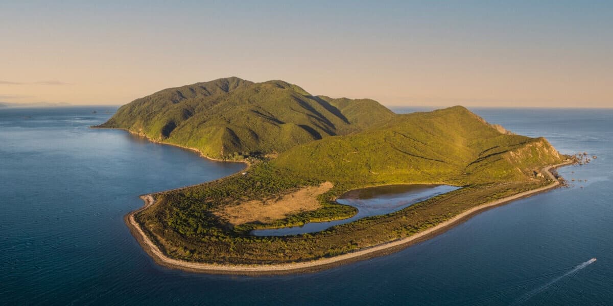 Aerial island coastline view with hiking trails and lagoons