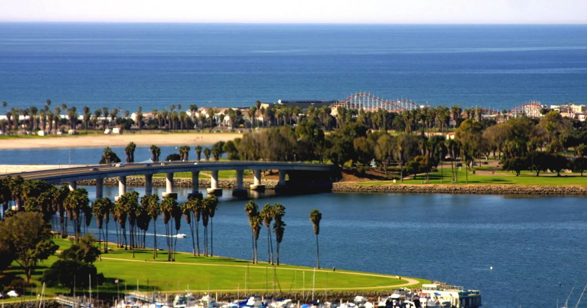 Coastal bay with palm-lined shoreline and calm ocean view