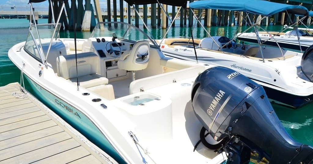 Dual-console boat at Jupiter Inlet dock, day charter preparation