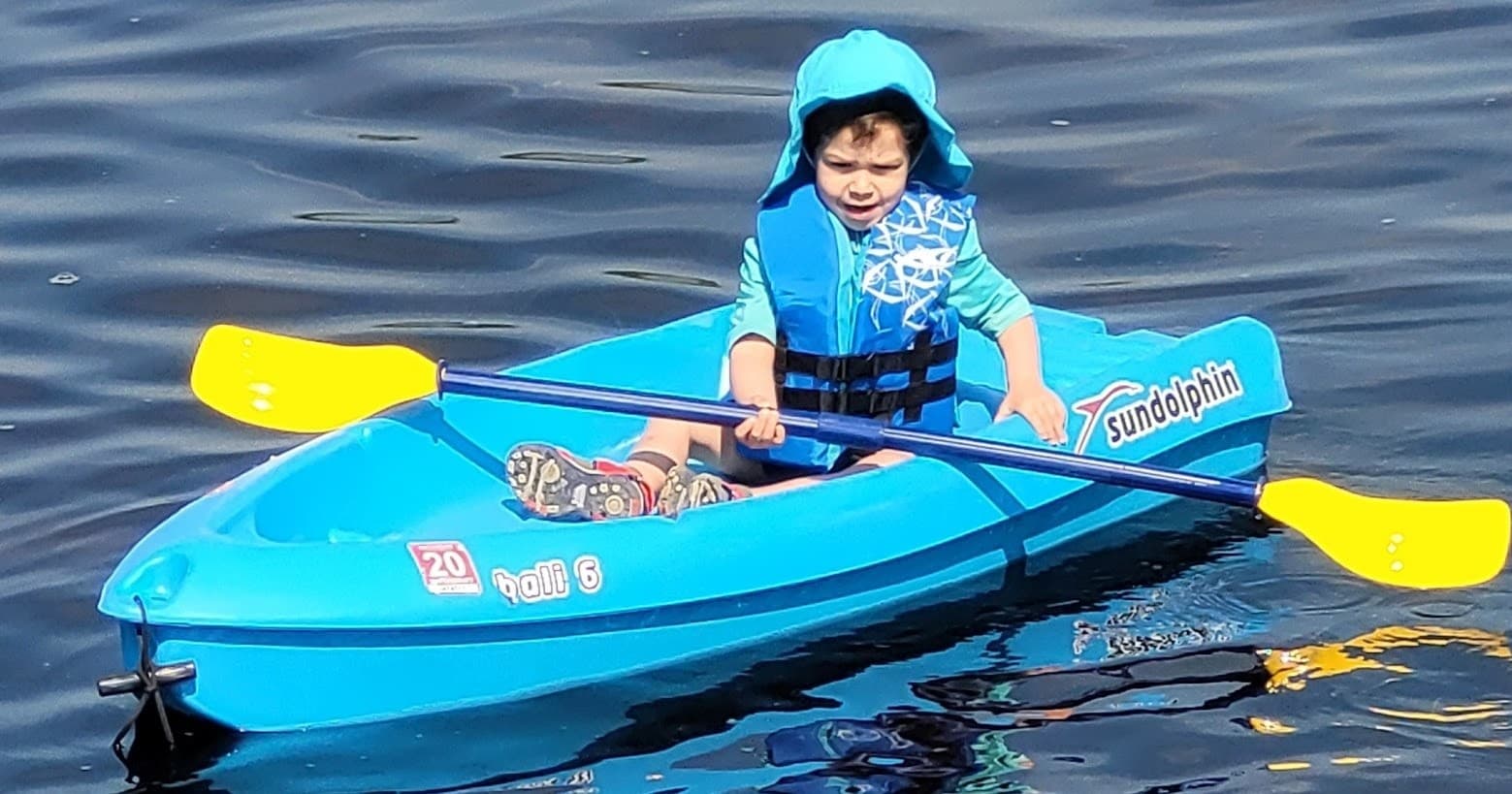 Crystal-clear coastal cove and rocky shoreline ideal for kayaking