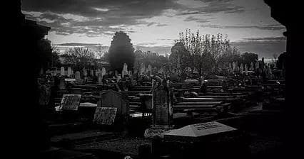 Historic cemetery at dusk, atmospheric walking tour through graves