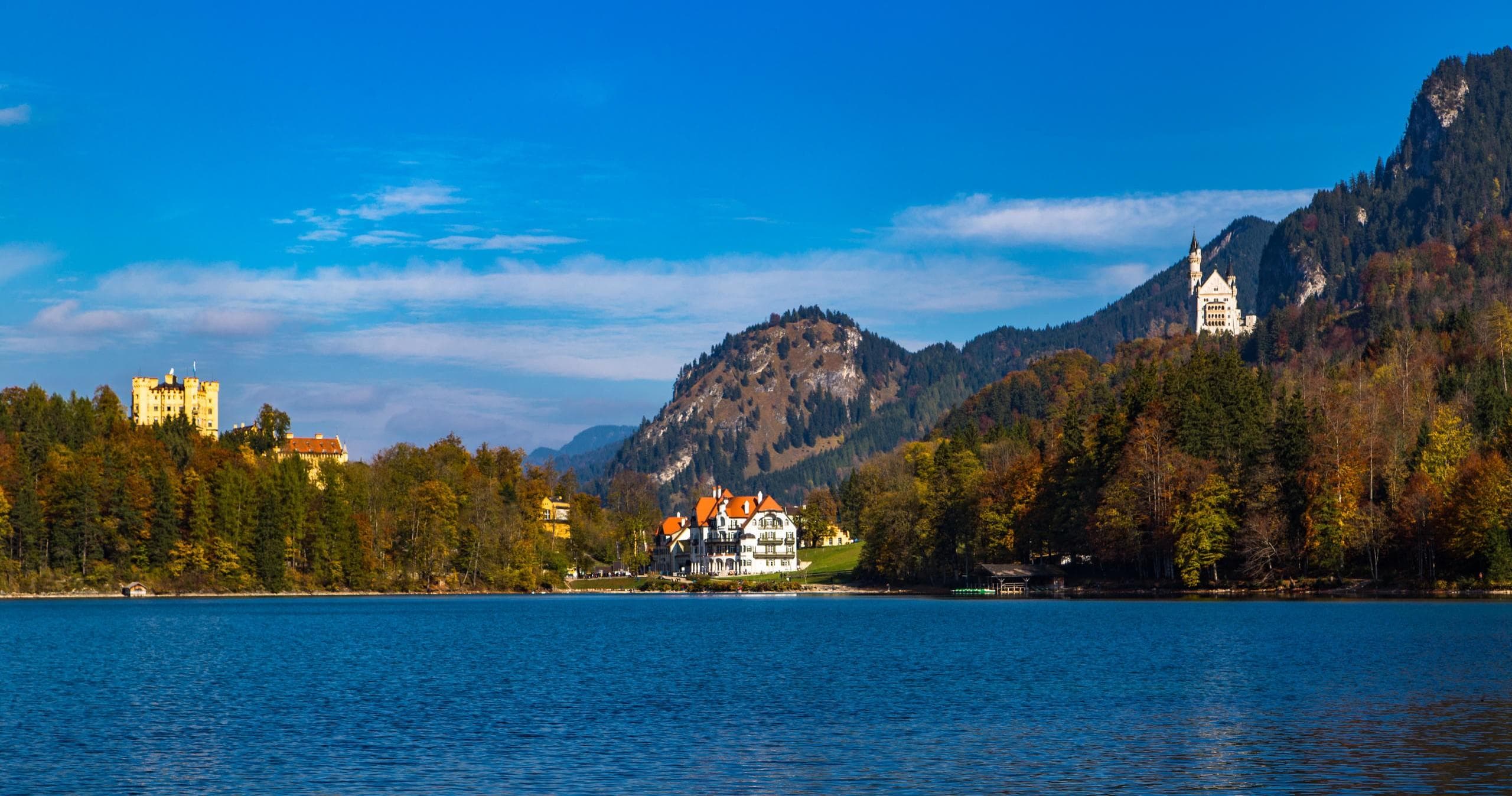 Lake view with distant royal castles on Bavarian shoreline