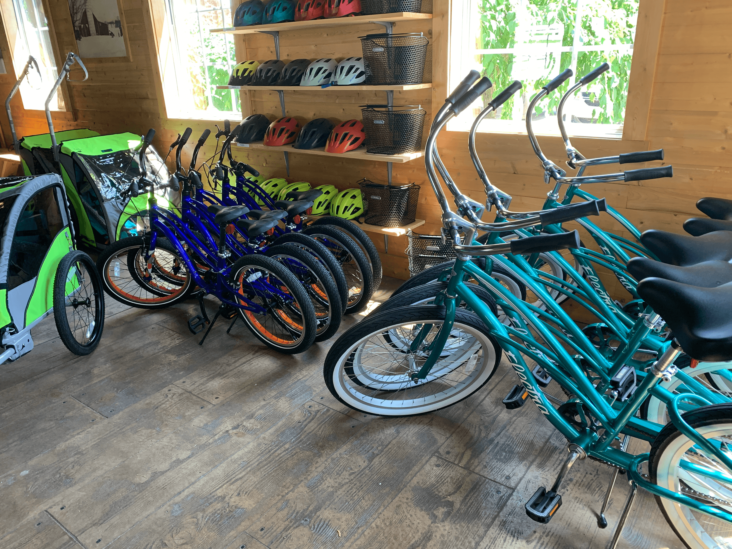 Rental bicycles lined up in wooden shed for country bike tours