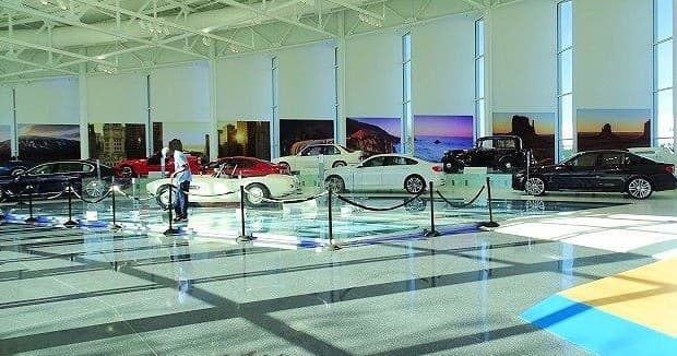 Indoor BMW showroom displaying multiple classic cars in polished gallery