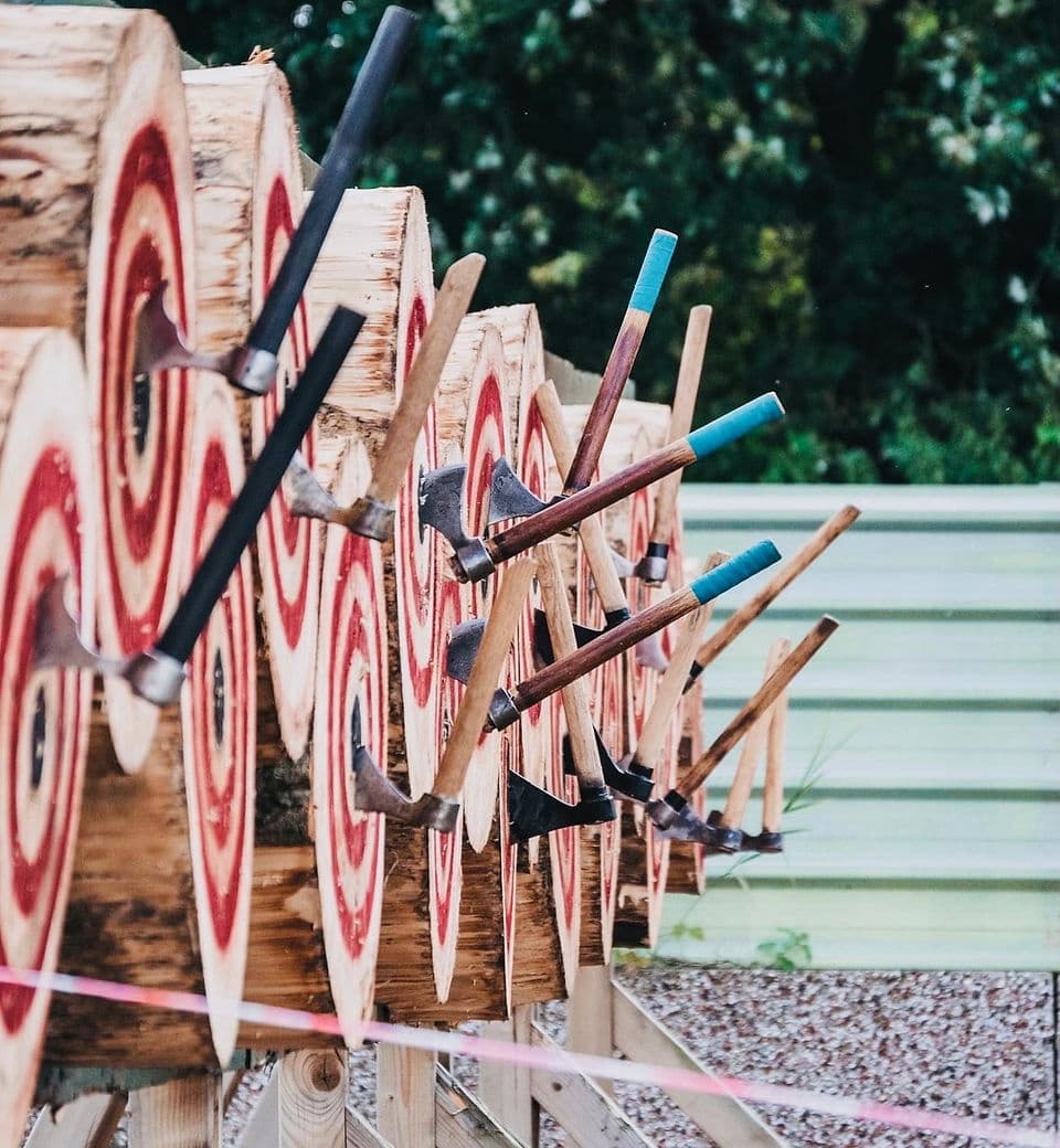 Multiple archery targets lined up on outdoor range for practice