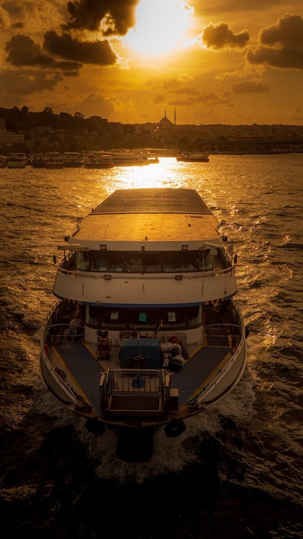 Sunset yacht cruise heading into glowing harbor on Chesapeake waters