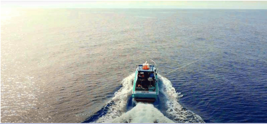 Motorboat cruising across open ocean near Lanzarote coast