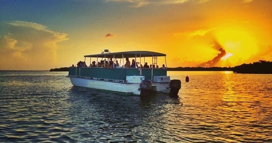Sunset boat cruise on Tampa Bay with passengers silhouetted