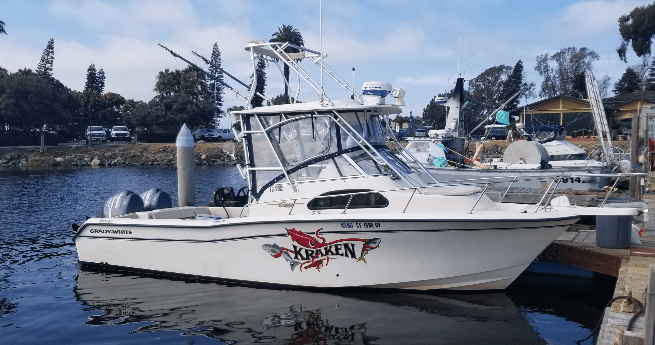 Fishing charter boat docked at coastal marina ready for angling trips