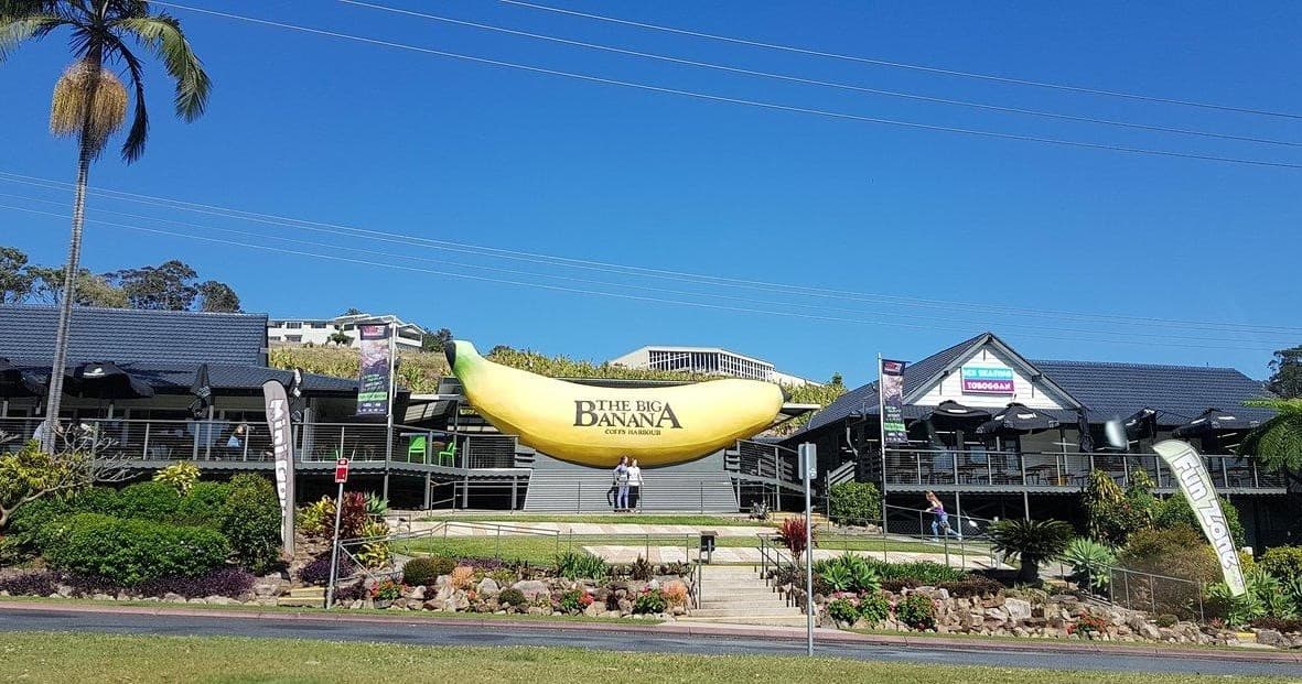 Wide shot of The Big Banana attraction and hilltop setting