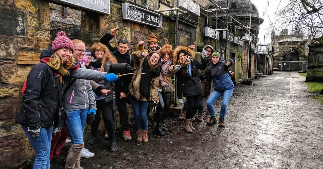 Group on outdoor Potter walking tour at historic stone village