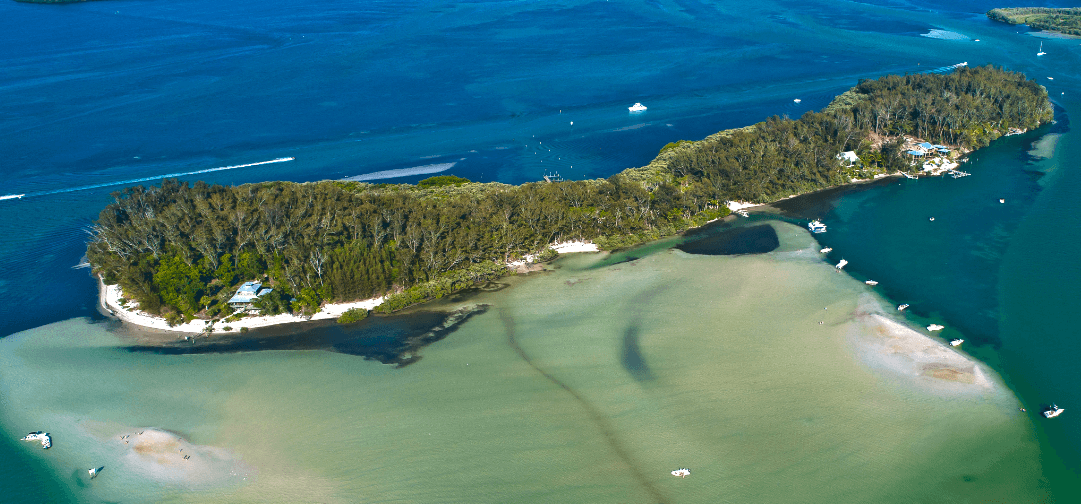 Aerial panorama of coastal island shoreline and clear water