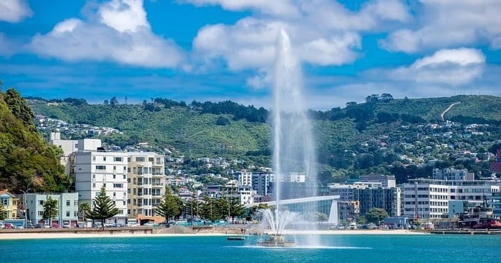 Waterfront fountain and city skyline, waterfront sightseeing
