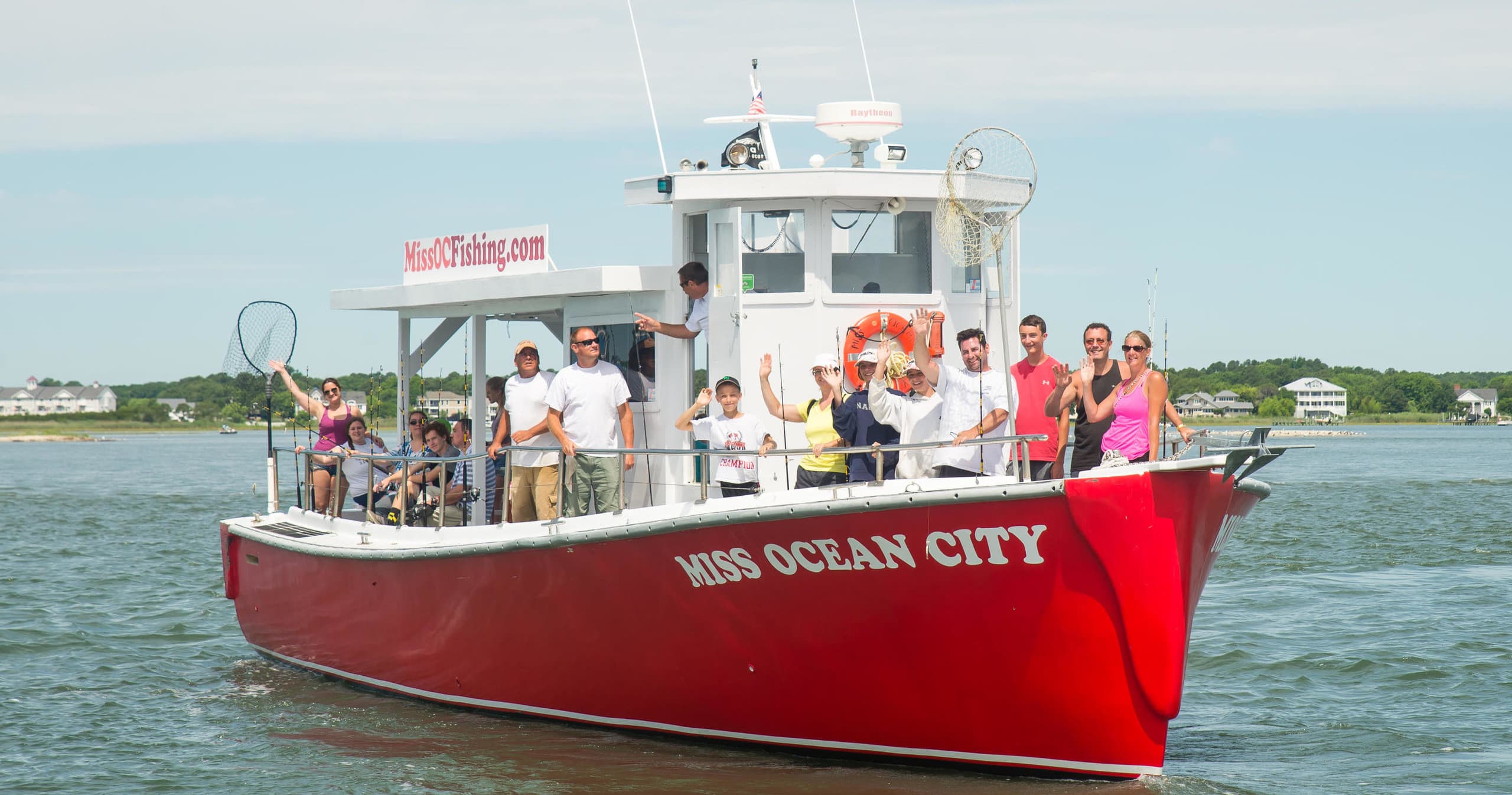 Fishing charter boat with passengers cruising coastal waters