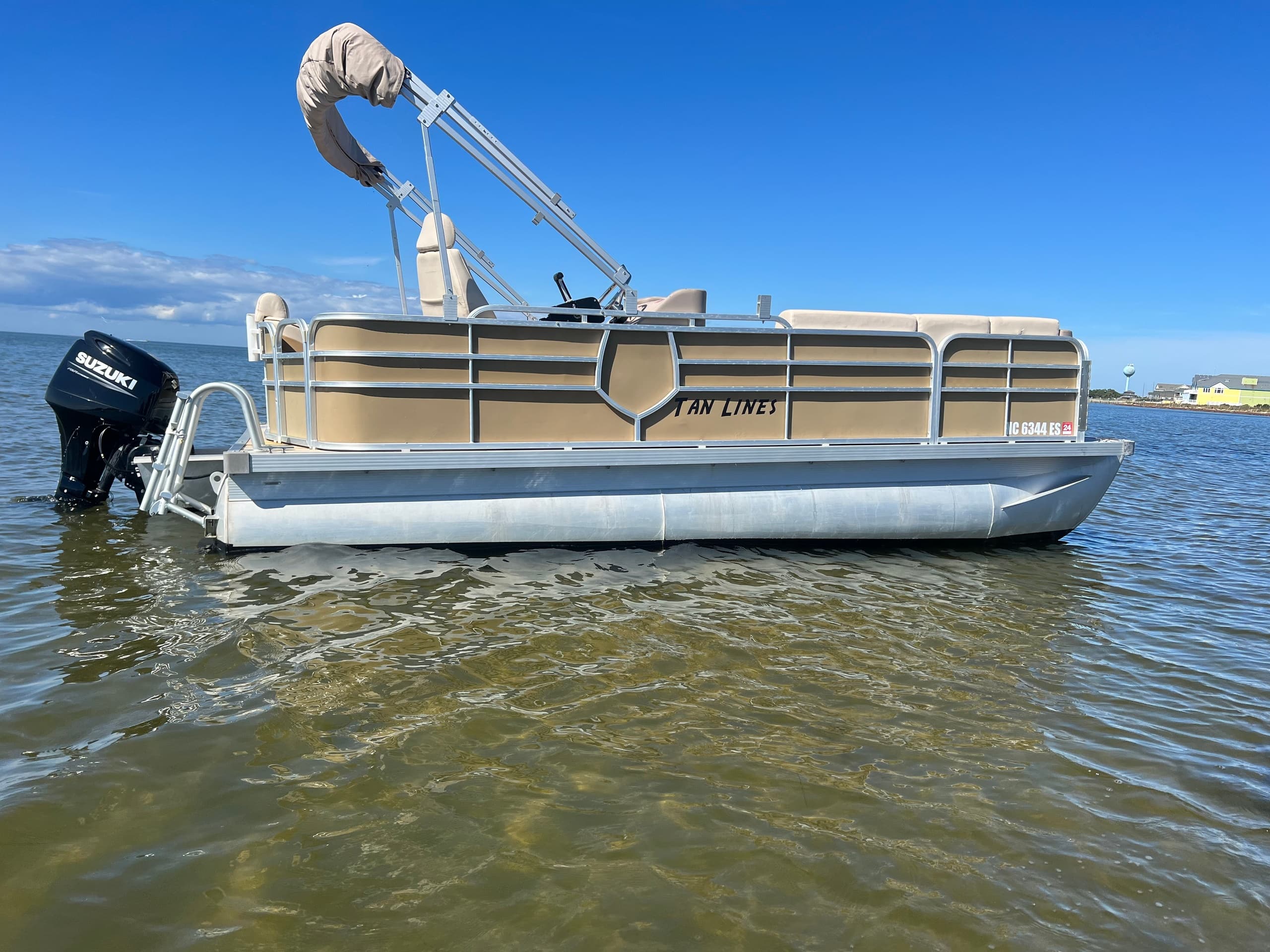 Explore the Outer Banks on the "TAN LINES" 50HP Yamaha: Premier 10-Passenger Boat Rental in Waves, NC