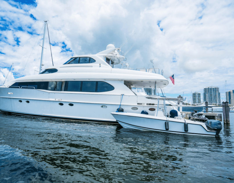 Luxury motor yacht docked in Miami marina with skyline view