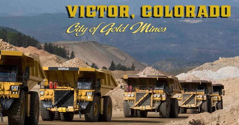 Heavy mining trucks lined at a gold mine near Victor, Colorado