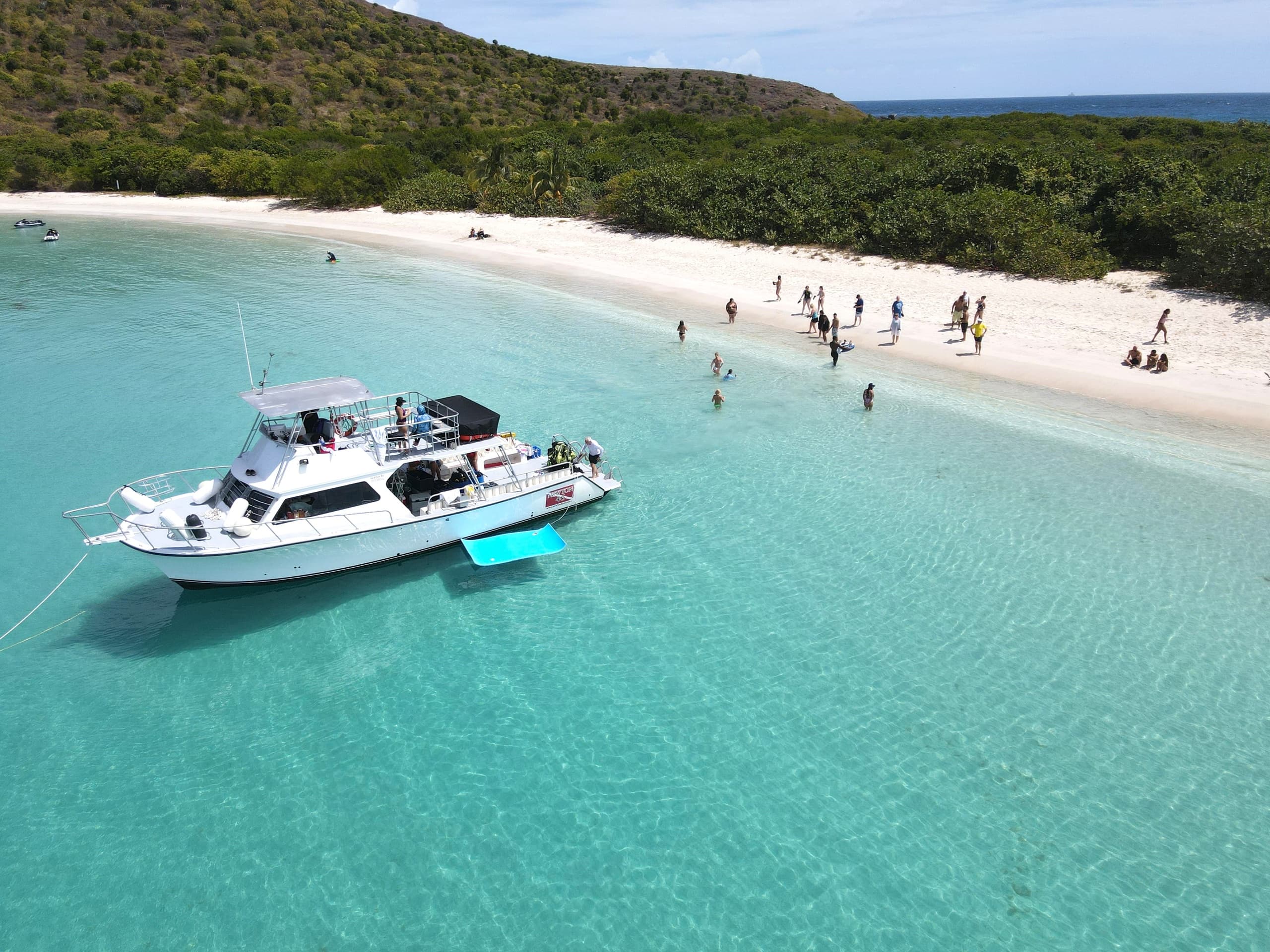 Aerial view of charter yacht anchored in Caribbean turquoise bay