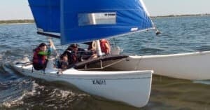 Catamaran sailing fast on open water during coastal race