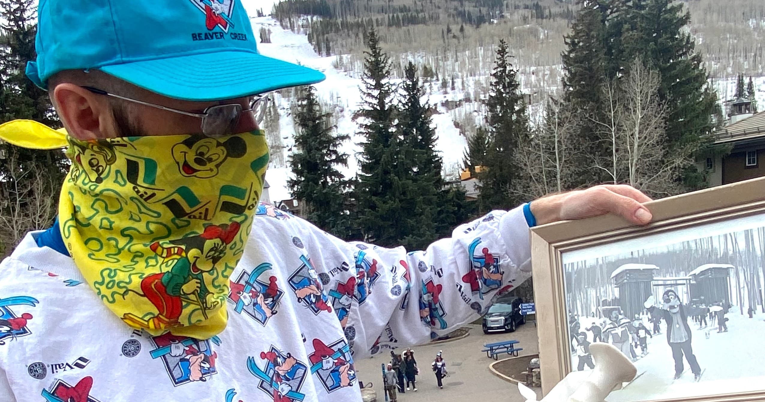 Guide leading walking tour in Vail mountain village with snowy trees