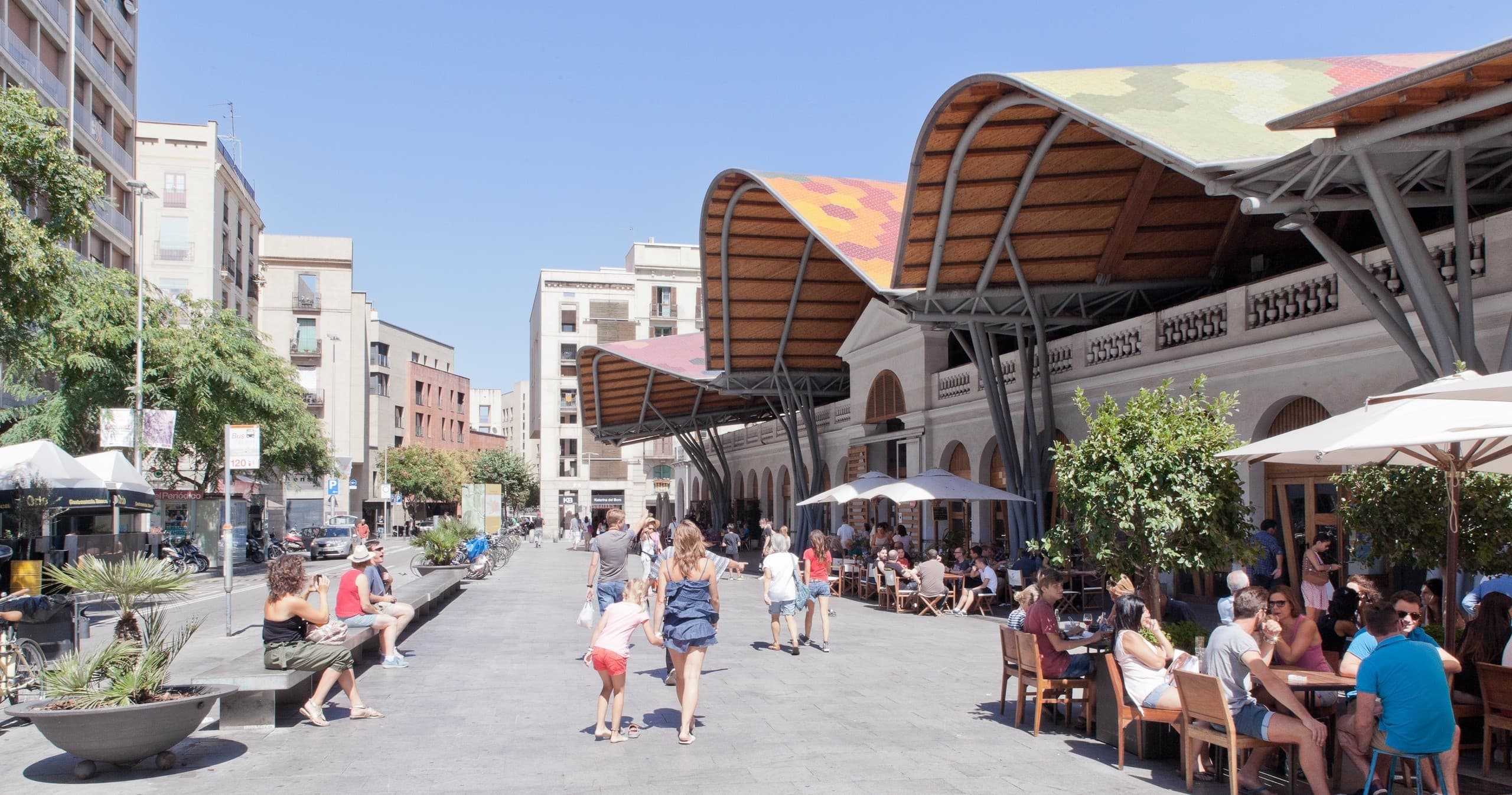 Outdoor market dining and pedestrian street in Barcelona