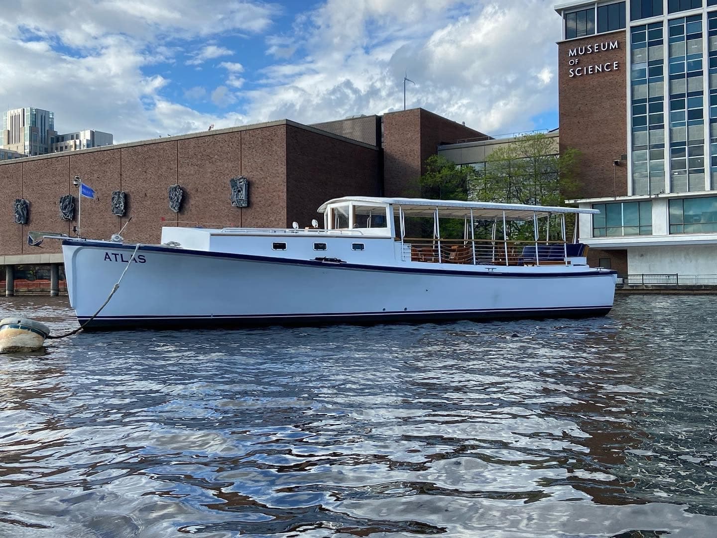 Private charter boat moored by Boston Museum of Science on Charles River