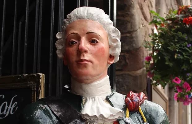 Decorative historical shop figure in old town street display