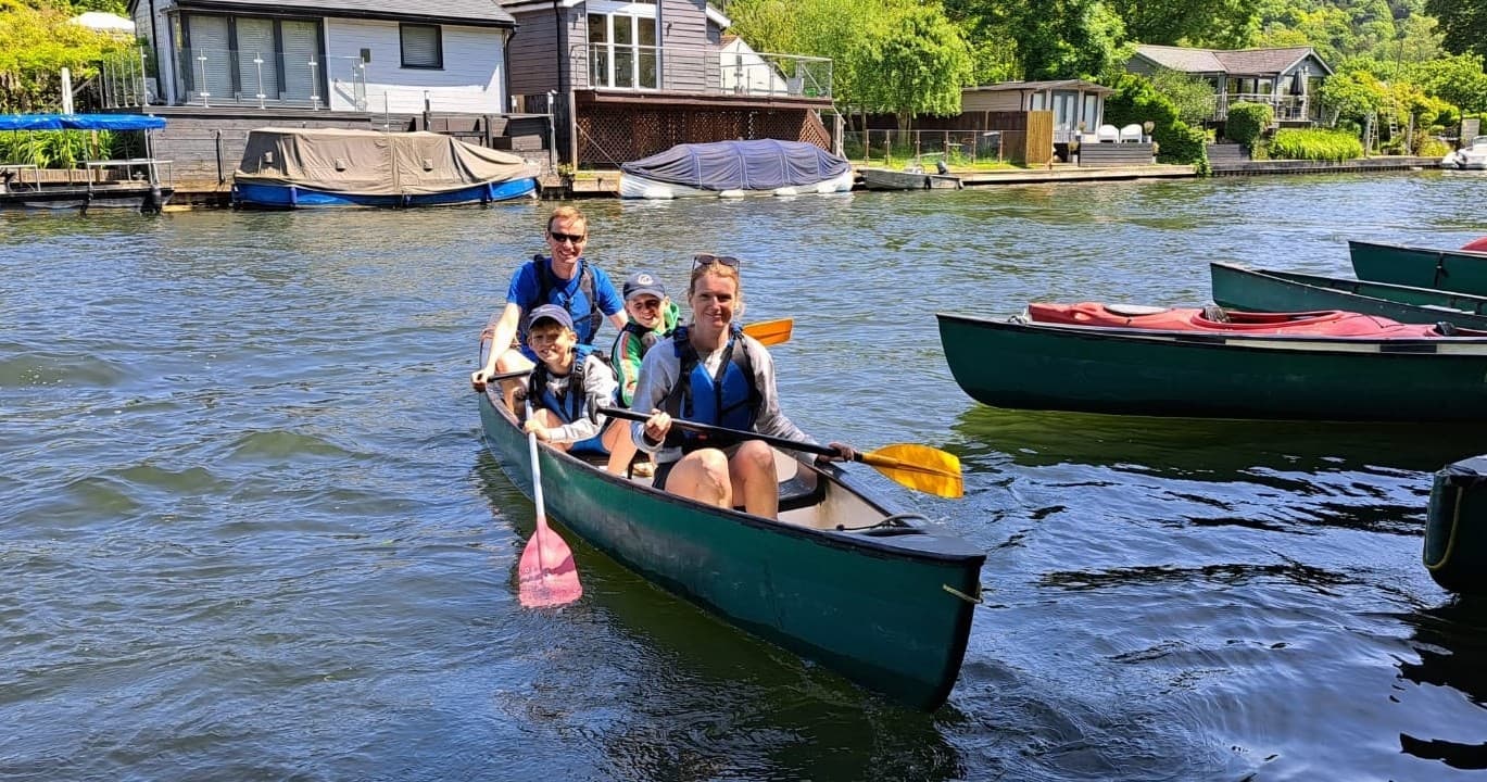 Family canoeing on River Thames near Henley, guided paddling trip