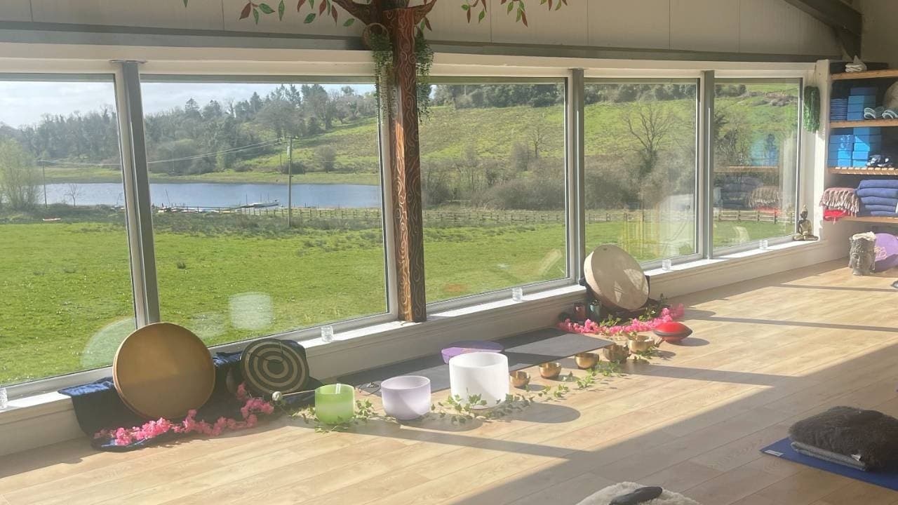 Wellness studio with windows overlooking lakeside scenery