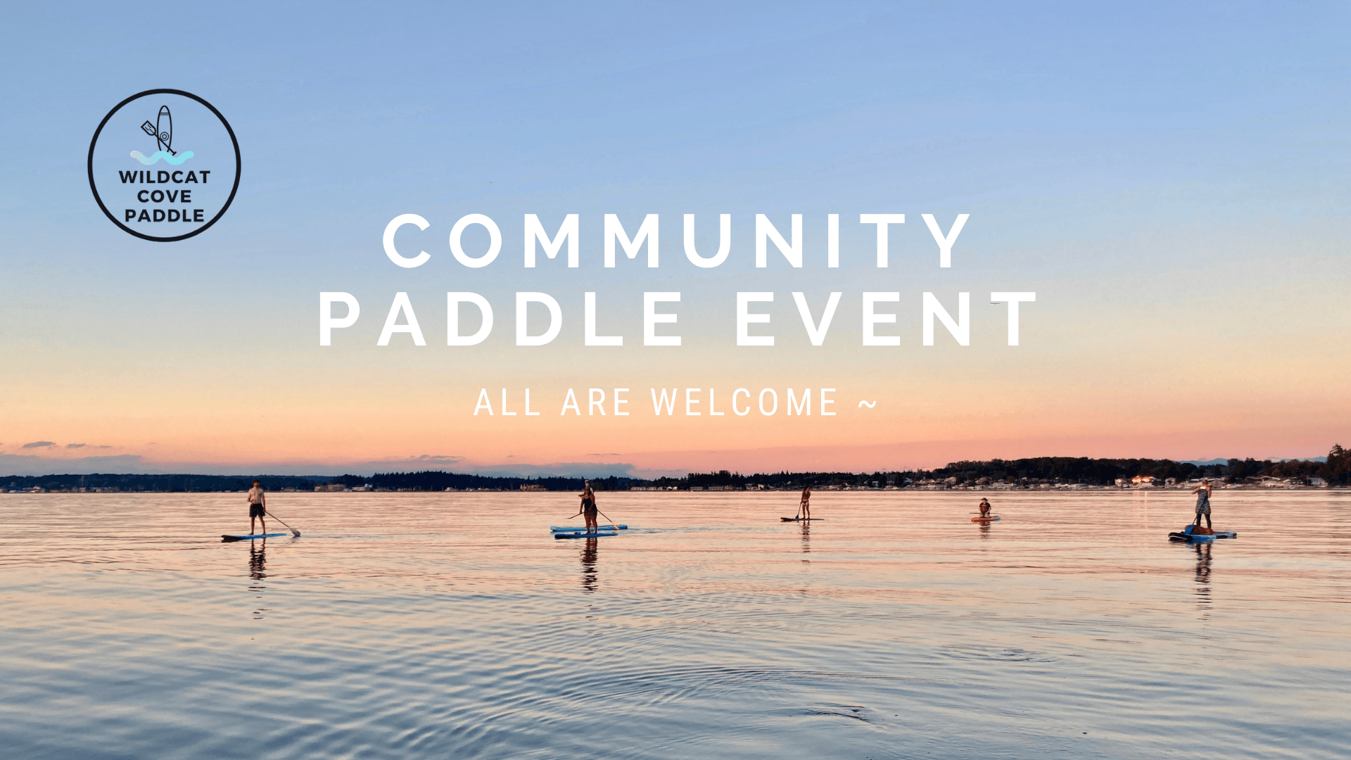 Group stand-up paddleboarding at sunset on calm coastal bay