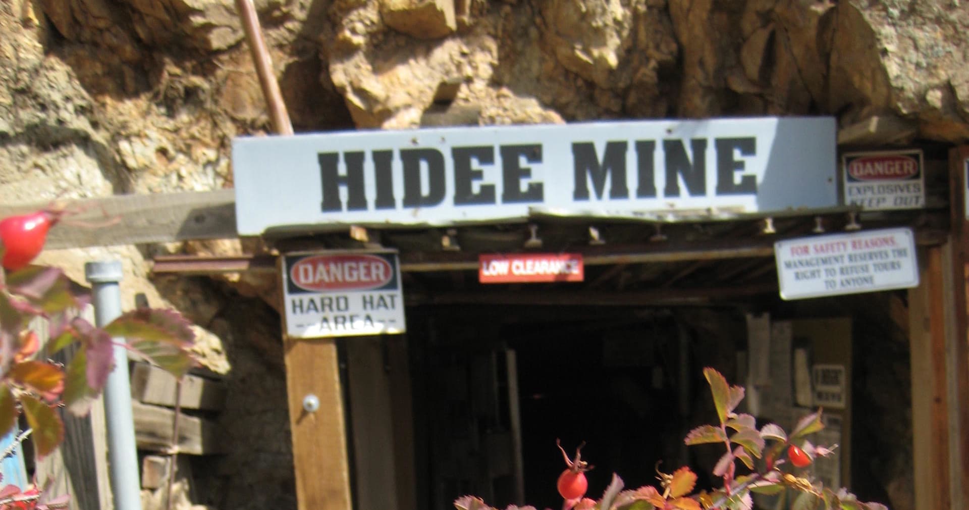 Historic Hidee Mine entrance with wooden sign at outdoor attraction