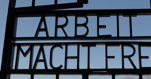 Historic 'Arbeit Macht Frei' gate detail at Auschwitz memorial
