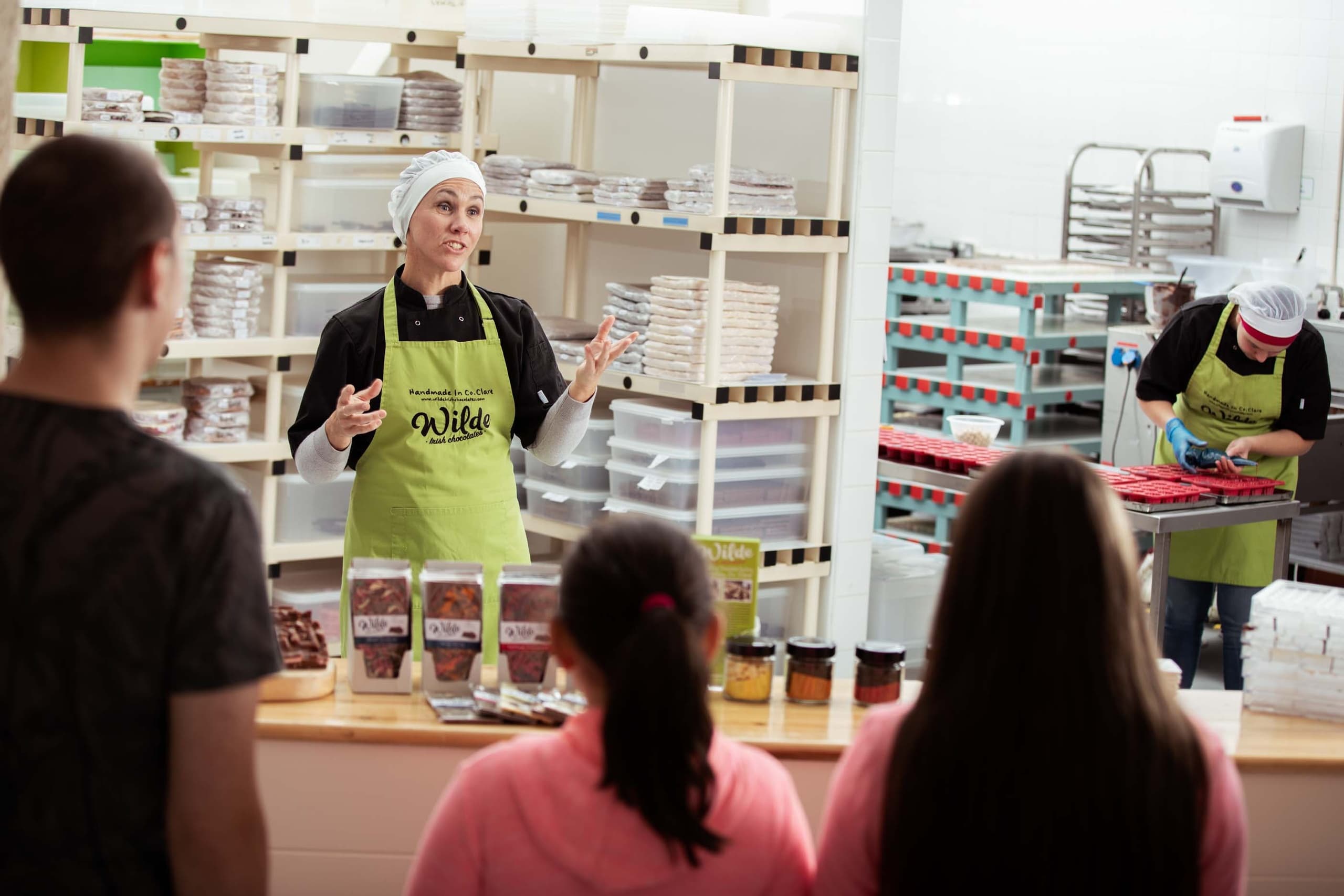 Chocolate workshop instructor teaching in artisan kitchen