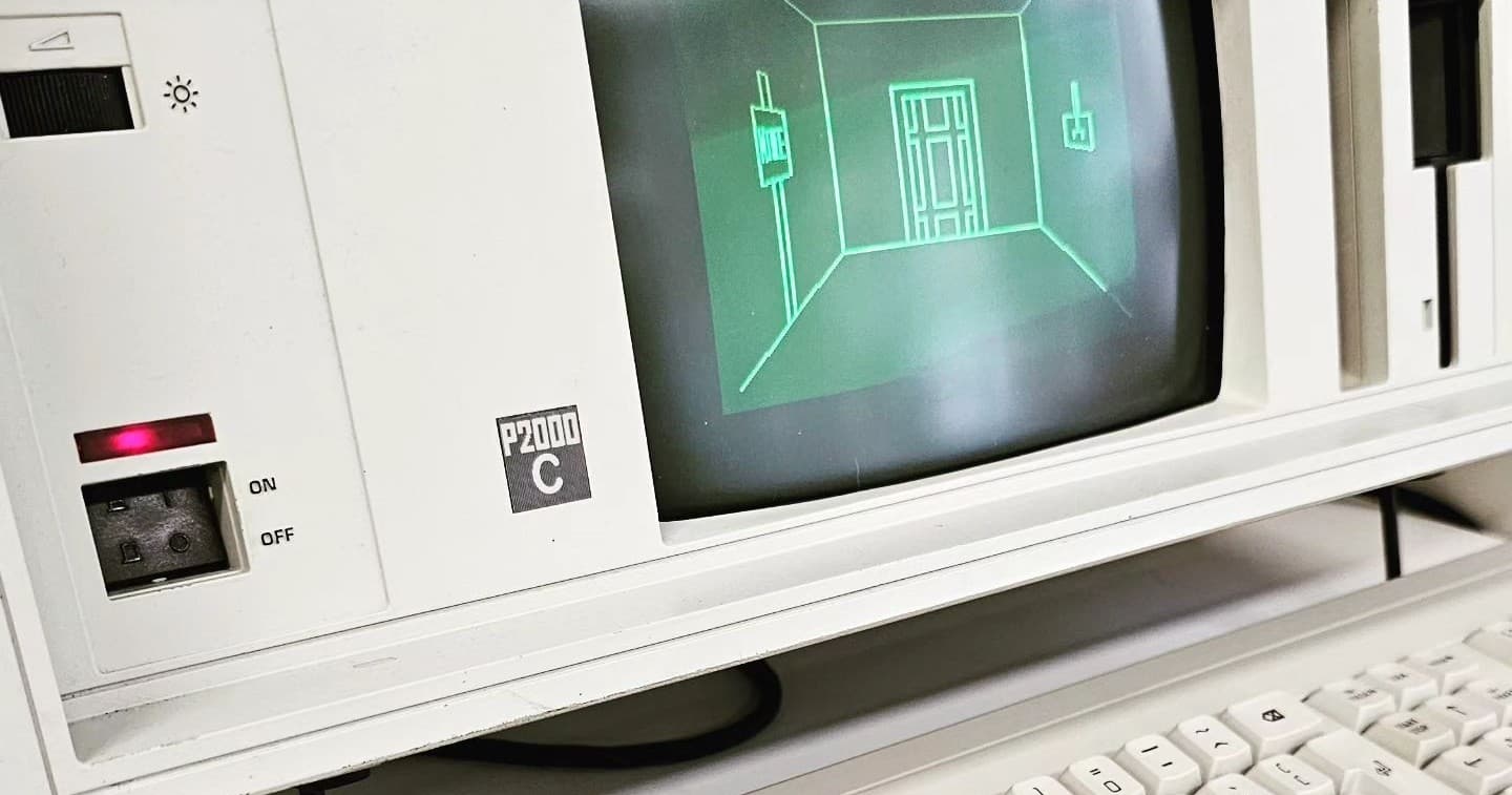 Green wireframe game displayed on vintage CRT in museum