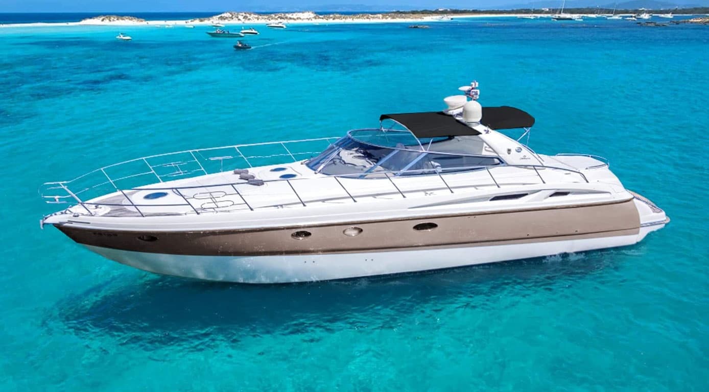 Luxury motor yacht cruising turquoise Marbella coast near shore