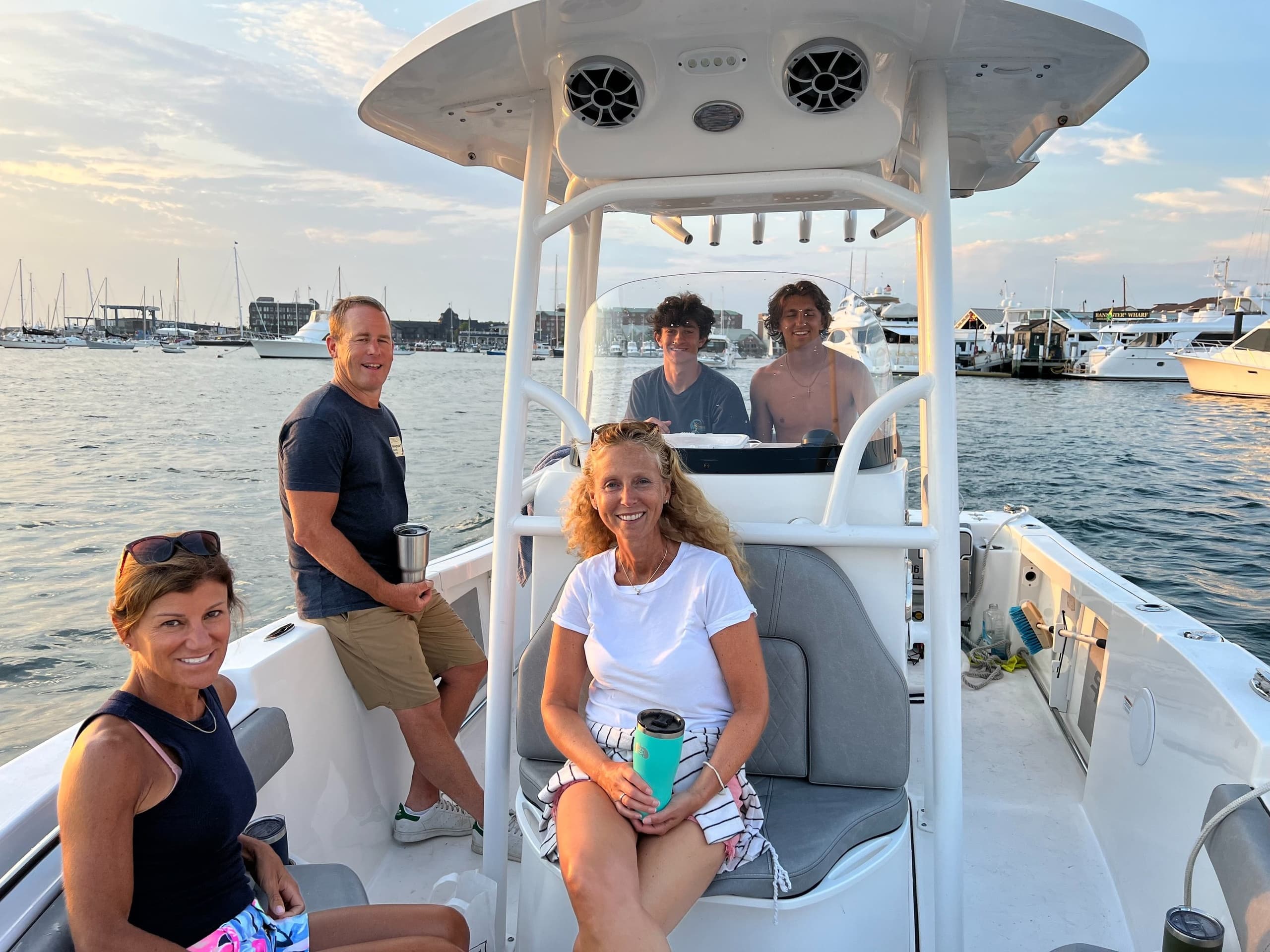 Friends enjoying Newport Harbor boat cruise aboard center-console