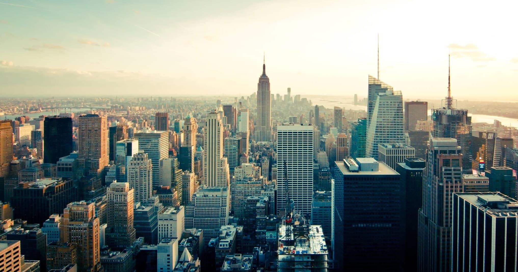 Panoramic Manhattan skyline at golden hour, urban skyline viewpoint
