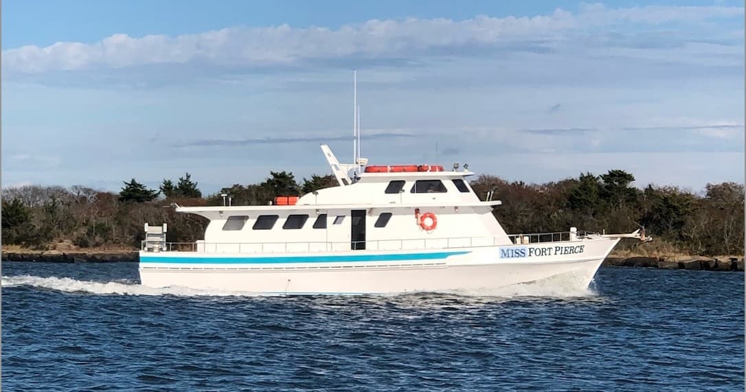 Fishing charter boat cruising coastal waters near Fort Pierce, Florida