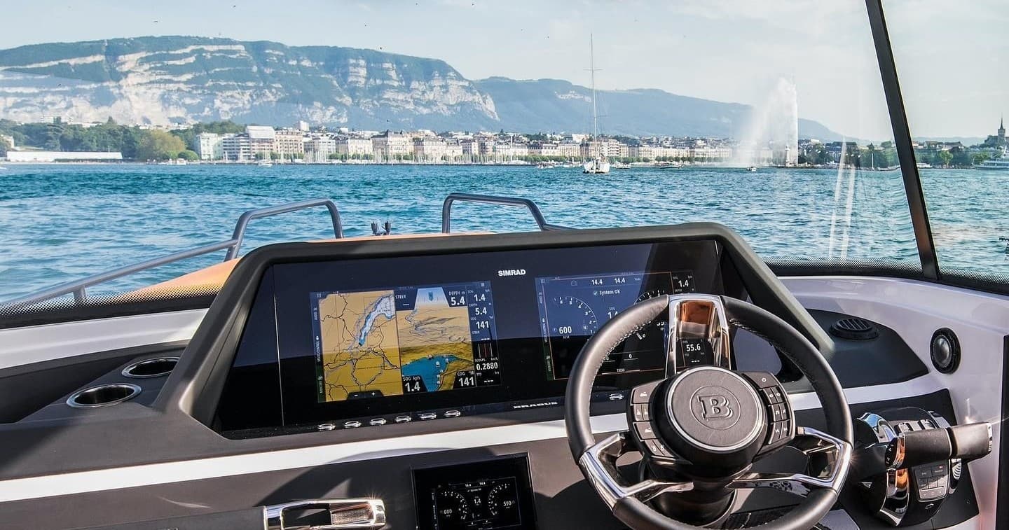 Boat helm with panoramic lake view and navigation screens