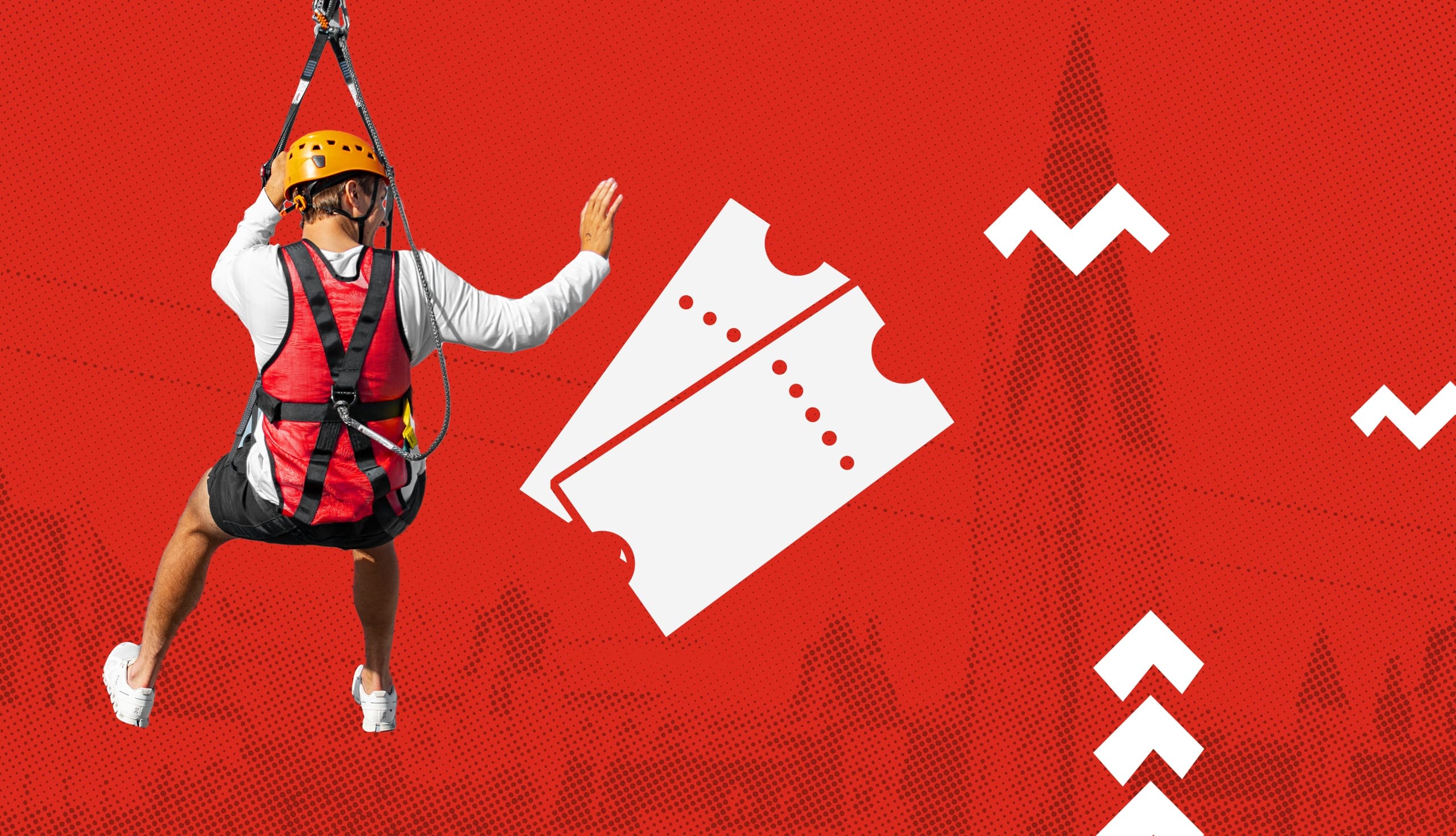 Zipliner in harness soaring over city skyline on an urban zipline