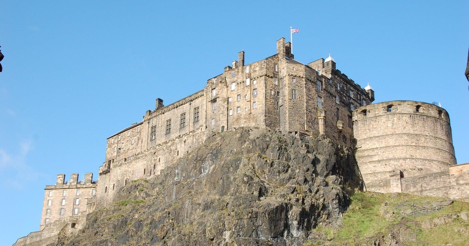 Historic Edinburgh Castle perched on volcanic rock, skyline view