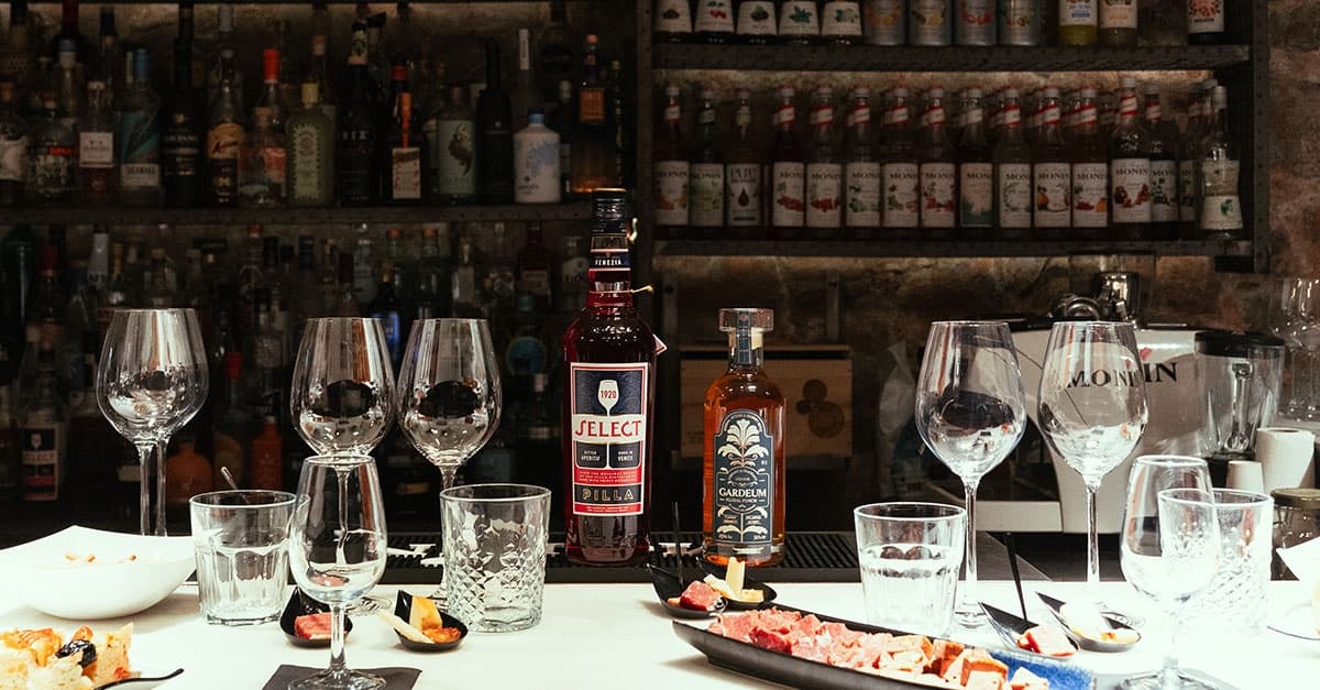 Wine tasting flight and glassware on rustic bar counter